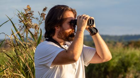 Jase Parnell-Brookes using binoculars
