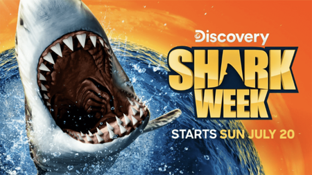 The poster for Shark Week 2025, featuring a Great White Shark with jaws agape alongside the Shark Week logo.